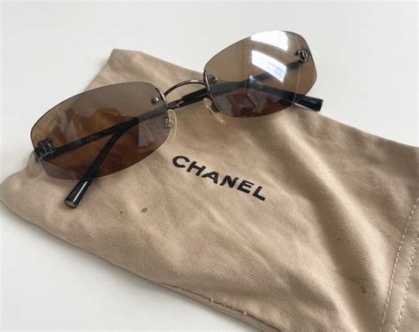 chanel bow sunglasses brown|chanel rimless sunglasses.